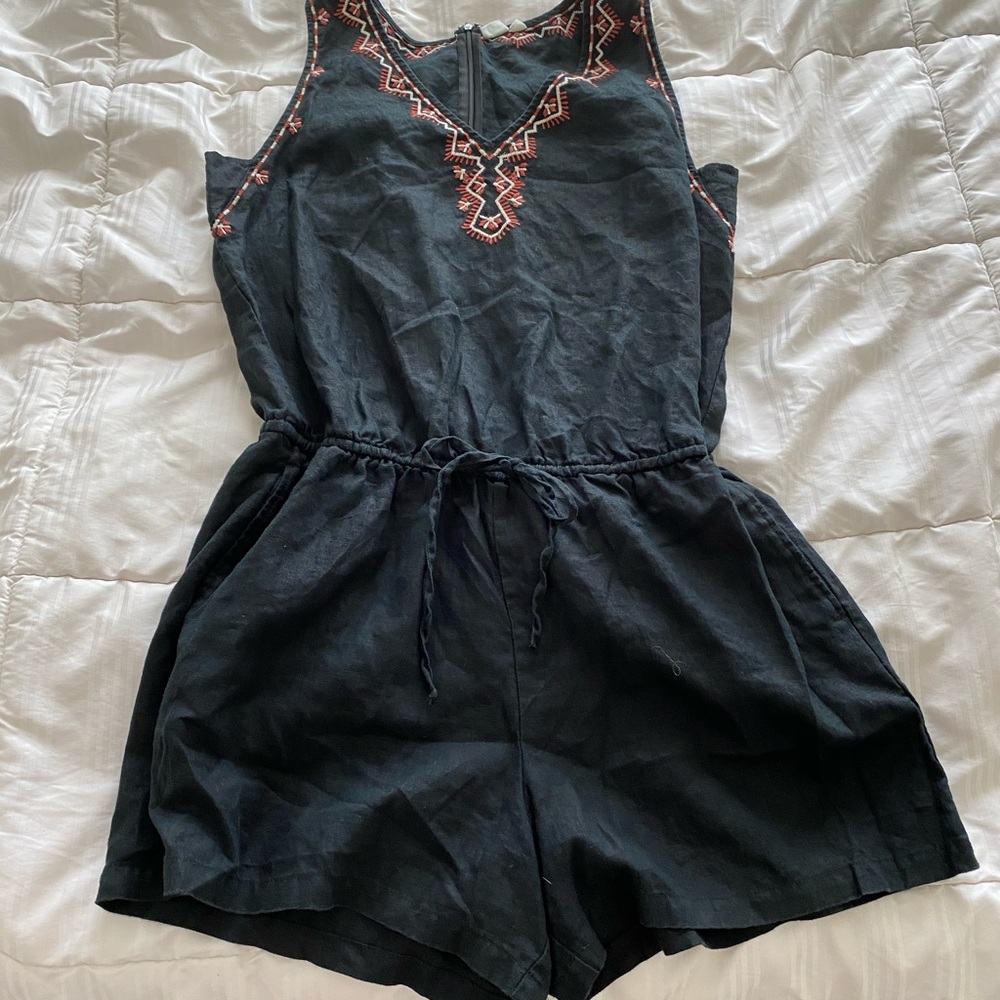 romper black with reddish and cream embroidery